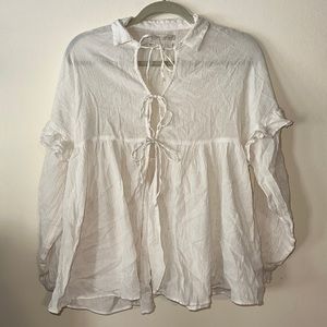 Ruffled cream blouse from Urban Outfitters